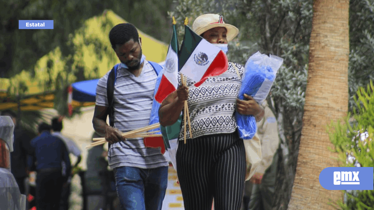 EMX-Haitianos son visto por las calles de Tijuana con banderas de México